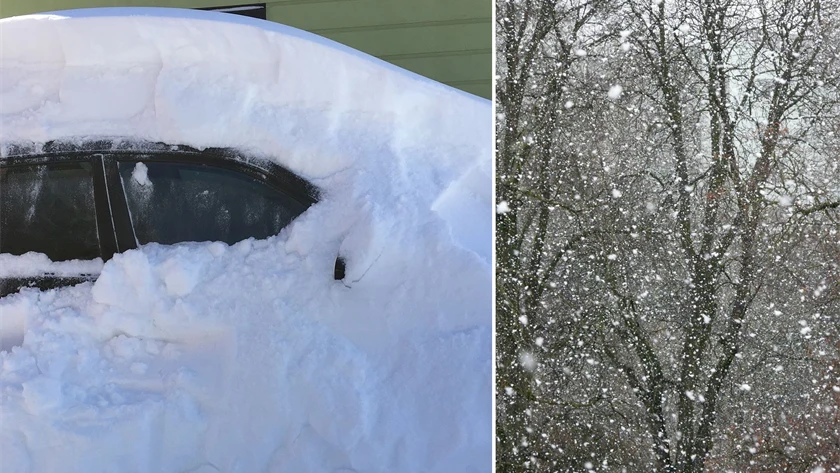 Bild på insnöad bil och snöoväder.